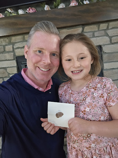 The founder of The Heaven Letters with his daughter, holding a hand-sealed letter